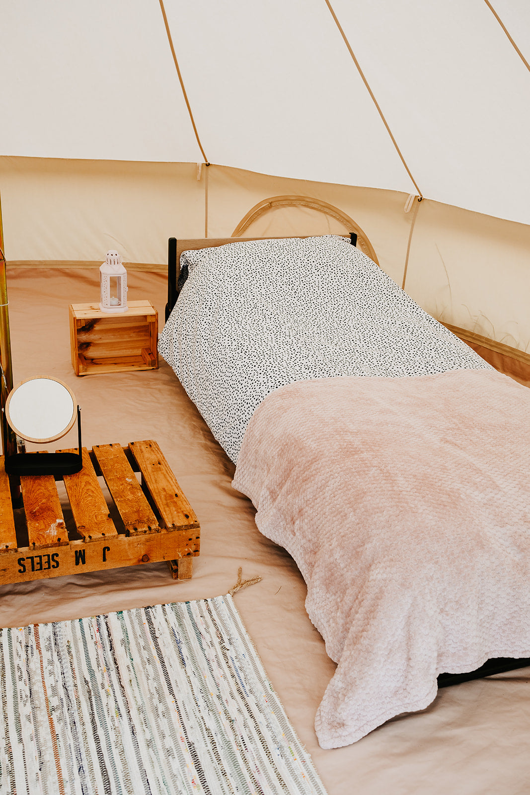 Folding bed inside 4m bell tent with mirror for glamping