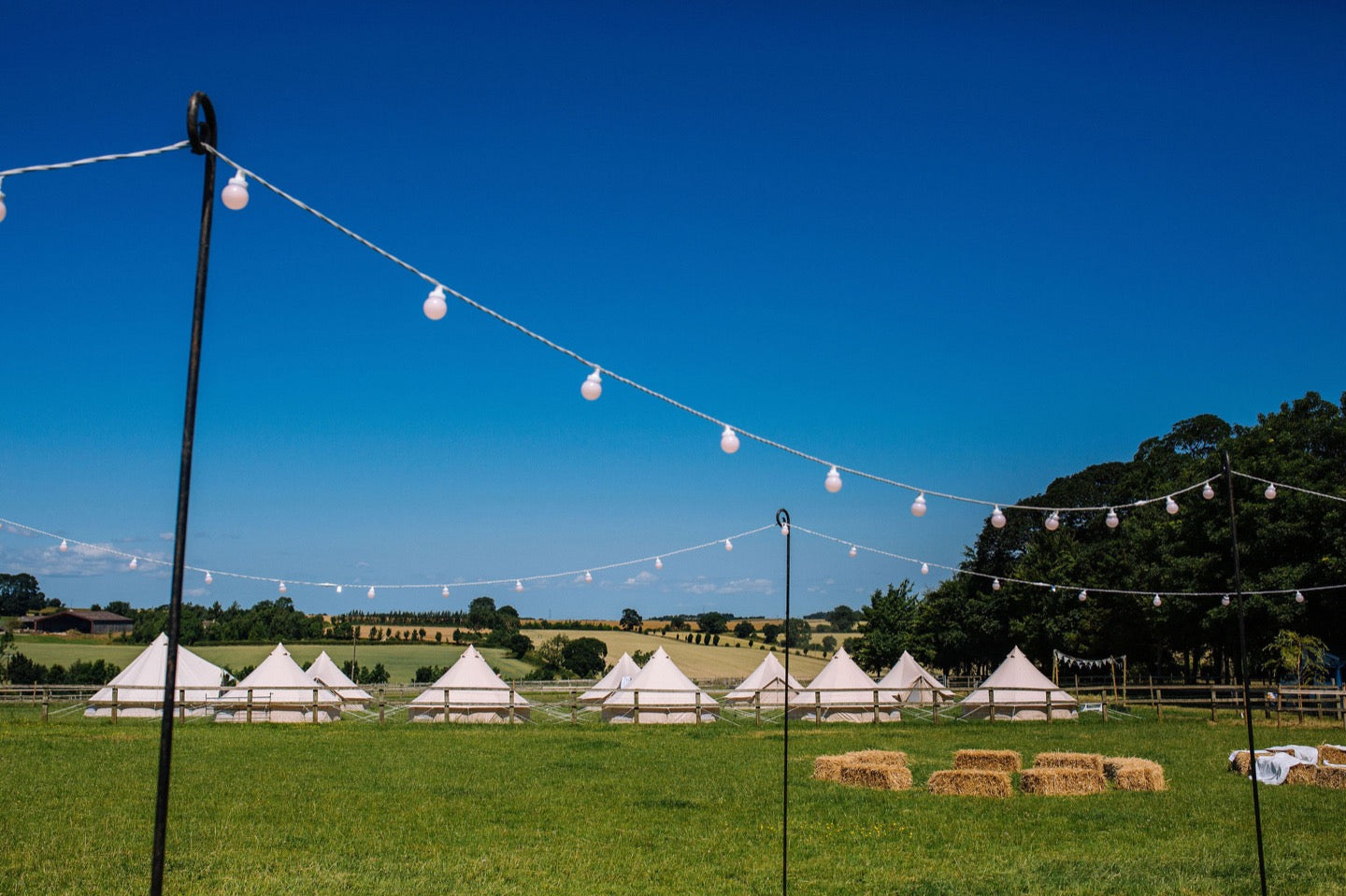 Bell Tent Village with Blue Sky and Solar Lights